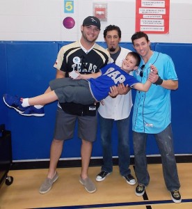 Oyster Creek Elementary student, Eduardo Guerra, is shown with Sugar Land Skeeters players (from left) Michael Nix, Kevin Rios and Adam Godwin.