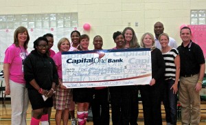 Stacey Rouze, DCMS nurse and volleyball assistant; Antwanita Bonom, DCMS volleyball coach; Chanel Johnson, DCMS volleyball coach; Heather Carroll, FBJSL Director of Community Relations; and Thomas Graham, DCMS Principal. Front row (l to r): Favour Alejo, Sugar Land volleyball player, Karen Efron, Sugar Land volleyball coach; Debbie Cooper, Sugar Land volleyball coach and co-coordinator of the Volley Pink Project; Versie Turner, DCMS volleyball coach; Stephanie Carter, DCMS volleyball coach; Cindy Dempster, FBJSL President; Debbie Buckner, FBJSL President-Elect; and Joshua McLain, co-coordinator of the Volley Pink Project.